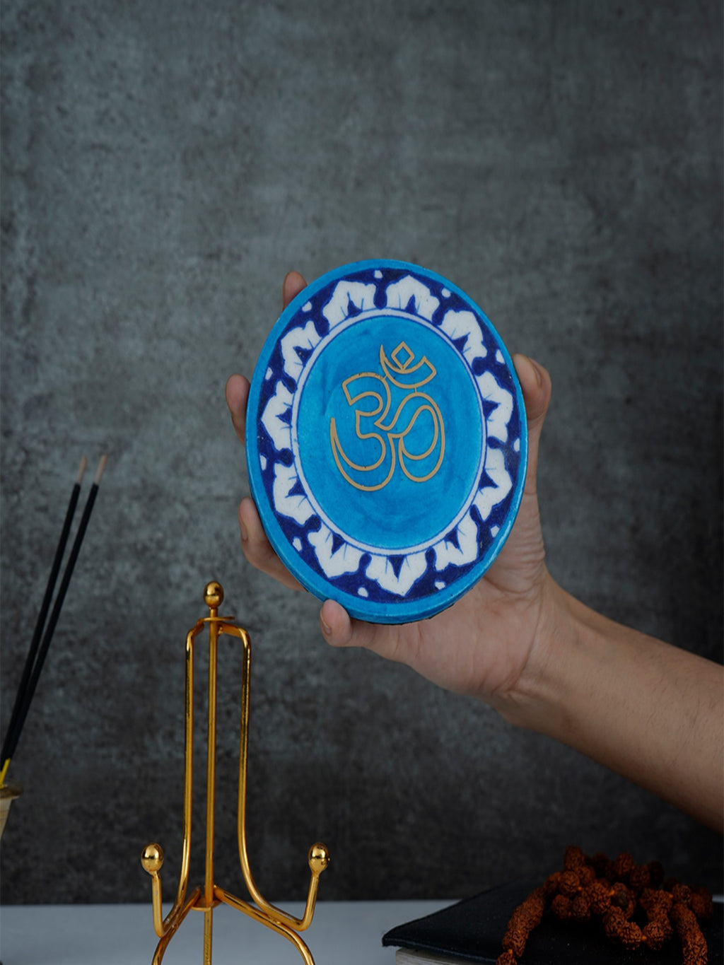 Om Handcrafted Blue Pottery Showpiece